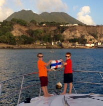 R&R hoisting the courtesy flag in St. Eustatia in front of the Quill volcano