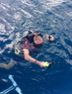 Randy putting those scuba lessons to work, diving the boat in Bequia