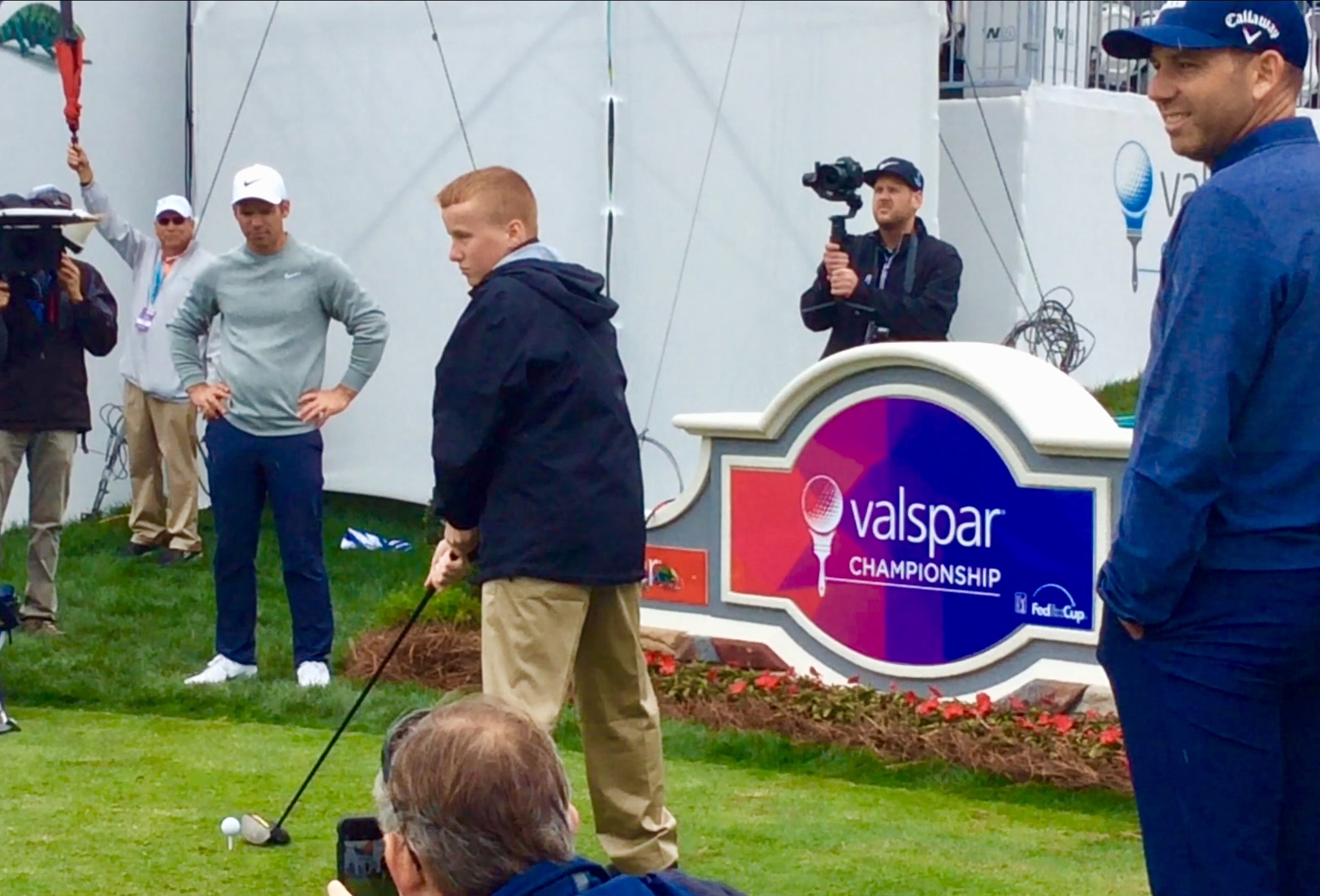 Ronan prepares to drive on the 18th (with Paul Casey and Sergio Garcia looking on) (March 2019)